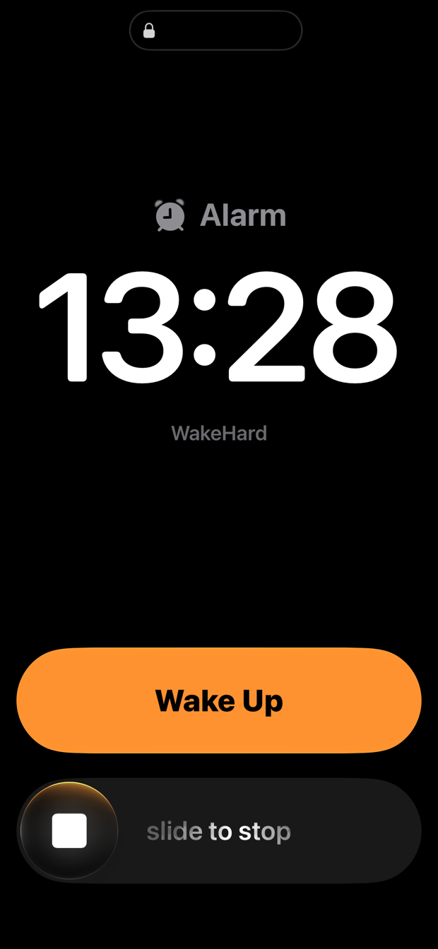 The alarm on the Lock Screen at 13:28, with a Wake Up button and slide to stop.